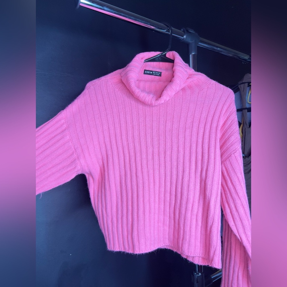 pink turtleneck sweater